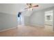 Cozy bedroom with neutral carpet, a ceiling fan, an ensuite bathroom, and dormer windows for natural light at 2051 E Piedmont Rd, Marietta, GA 30062