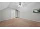 Carpeted bedroom with vaulted ceilings and recessed lighting and a mounted television at 2051 E Piedmont Rd, Marietta, GA 30062