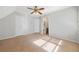 Open bedroom with neutral carpet and access to a bathroom at 2051 E Piedmont Rd, Marietta, GA 30062