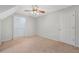 Bedroom with neutral carpet, ceiling fan, and a closet at 2051 E Piedmont Rd, Marietta, GA 30062
