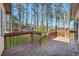 Close-up of a wooden deck overlooking trees and green lawn at 2051 E Piedmont Rd, Marietta, GA 30062