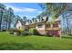 Traditional home with a lush green lawn, offering a serene and inviting curb appeal at 2051 E Piedmont Rd, Marietta, GA 30062