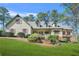 Well-manicured lawn complements this charming home with red shutters and a welcoming front porch at 2051 E Piedmont Rd, Marietta, GA 30062
