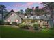 Charming two-story home featuring dormer windows, a welcoming front porch, and a well-maintained lawn at 2051 E Piedmont Rd, Marietta, GA 30062