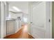 Bright kitchen view with white cabinets, granite counters, and hardwood floors at 2051 E Piedmont Rd, Marietta, GA 30062