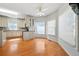 Kitchen view features granite countertops, white cabinets, hardwood floors, and window at 2051 E Piedmont Rd, Marietta, GA 30062