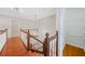 Upper level landing with wood flooring, chandelier, and a view of closet storage options at 2051 E Piedmont Rd, Marietta, GA 30062