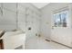 Practical laundry room with sink, storage shelves, and access to the outdoors at 2051 E Piedmont Rd, Marietta, GA 30062