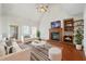 Bright living room features a fireplace, vaulted ceilings, and comfortable seating, perfect for relaxation at 2051 E Piedmont Rd, Marietta, GA 30062