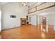 Living room features a brick fireplace, wood floors, and entry door at 2051 E Piedmont Rd, Marietta, GA 30062
