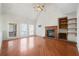 Living room features fireplace with wood mantle and built-in shelving at 2051 E Piedmont Rd, Marietta, GA 30062