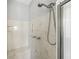 Close up of a luxurious shower with a rainfall showerhead and marble walls at 2051 E Piedmont Rd, Marietta, GA 30062