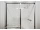 Enclosed shower with sliding doors, adjustable showerhead, and built-in shelf at 2051 E Piedmont Rd, Marietta, GA 30062