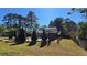 Large grassy backyard featuring a well-maintained lawn, pool, and privacy fence at 3007 Hidden Dr, Lawrenceville, GA 30044