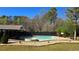 Serene backyard featuring a private pool, hot tub, and carefully manicured landscaping at 3007 Hidden Dr, Lawrenceville, GA 30044