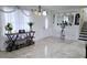 Inviting entryway featuring tiled floors, modern decor, staircase, and an abundance of natural light at 3007 Hidden Dr, Lawrenceville, GA 30044