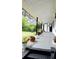 Covered front porch with plants and landscaping at 3007 Hidden Dr, Lawrenceville, GA 30044