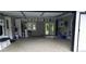 Spacious garage with ample storage cabinets, patterned floors, and access to the backyard at 3007 Hidden Dr, Lawrenceville, GA 30044