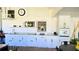 Outdoor kitchen includes white cabinets, countertop space, sink, and grill at 3007 Hidden Dr, Lawrenceville, GA 30044