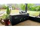 Outdoor kitchen with a grill and bar area for entertaining at 3007 Hidden Dr, Lawrenceville, GA 30044