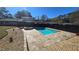 The pristine in-ground pool with spa is surrounded by stone and decorative landscaping at 3007 Hidden Dr, Lawrenceville, GA 30044