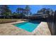 Beautiful in-ground pool surrounded by flagstone paving and lush landscaping, perfect for relaxation at 3007 Hidden Dr, Lawrenceville, GA 30044