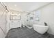 Bathroom featuring a soaking tub, glass enclosed shower, and double sink vanity at 793 Joseph E Boone Nw Blvd, Atlanta, GA 30314