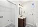 Bathroom with single sink vanity and unique black and white tile floor at 793 Joseph E Boone Nw Blvd, Atlanta, GA 30314