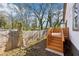 Wooden deck with stairs leading to yard with trees in background at 793 Joseph E Boone Nw Blvd, Atlanta, GA 30314