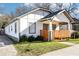 A beautiful front view of a home with a horizontal wood-slat porch fence, and easy driveway access at 793 Joseph E Boone Nw Blvd, Atlanta, GA 30314