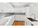 Kitchen view featuring white cabinets, quartz countertops, and decorative backsplash at 793 Joseph E Boone Nw Blvd, Atlanta, GA 30314