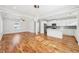 Open concept kitchen and living room with hardwood floors and white kitchen cabinets at 793 Joseph E Boone Nw Blvd, Atlanta, GA 30314
