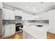 Kitchen with stainless steel appliances, center island, and white cabinets at 793 Joseph E Boone Nw Blvd, Atlanta, GA 30314