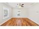 Spacious living room with hardwood floors, ceiling fan, and large windows at 793 Joseph E Boone Nw Blvd, Atlanta, GA 30314
