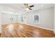 Sun-filled living room featuring hardwood floors and a ceiling fan for added comfort at 793 Joseph E Boone Nw Blvd, Atlanta, GA 30314