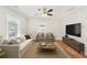 Cozy living room featuring a stylish sofa, chairs, and a modern entertainment center at 793 Joseph E Boone Nw Blvd, Atlanta, GA 30314