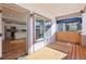 Covered porch overlooking the home's new kitchen and backyard with a modern wood-slat privacy fence at 793 Joseph E Boone Nw Blvd, Atlanta, GA 30314