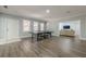 Large basement area with luxury vinyl plank flooring, ping pong table, and living area at 1913 Shenley Park Ln, Duluth, GA 30097