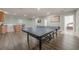 Open finished basement with hardwood floors and a game area at 1913 Shenley Park Ln, Duluth, GA 30097