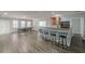 Spacious basement with game area, bar with stools, and neutral gray paint at 1913 Shenley Park Ln, Duluth, GA 30097