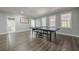 Open finished basement with hardwood floors and a game area at 1913 Shenley Park Ln, Duluth, GA 30097