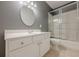 Bathroom featuring a light colored vanity, mirror, and sliding glass shower doors at 1913 Shenley Park Ln, Duluth, GA 30097