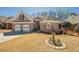 Charming one-story brick home featuring a two-car garage and well-manicured front lawn at 1913 Shenley Park Ln, Duluth, GA 30097