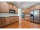 Well-equipped kitchen with stainless steel appliances and ample wood cabinetry at 1913 Shenley Park Ln, Duluth, GA 30097