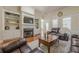 Spacious living room featuring hardwood floors, a fireplace, and built-in shelving at 1913 Shenley Park Ln, Duluth, GA 30097