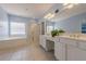 Bright main bathroom featuring a large tub, glass shower, and double sink vanity at 1913 Shenley Park Ln, Duluth, GA 30097