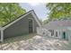 Back deck with an outdoor entrance into a second story room with gray siding at 2000 Mcconnell Rd, Grayson, GA 30017