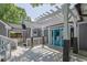 Backyard featuring a large deck with a pergola, gray siding, and colorful doors at 2000 Mcconnell Rd, Grayson, GA 30017