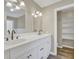 Bathroom featuring double sinks, white cabinetry, and modern fixtures at 2000 Mcconnell Rd, Grayson, GA 30017
