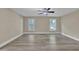 Bright bedroom featuring hardwood floors, neutral paint and lots of sunlight at 2000 Mcconnell Rd, Grayson, GA 30017